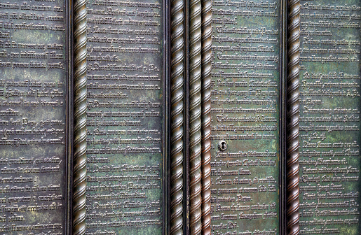 Exterior view of the theses portal with the 95 latin disputation theses of Martin Luther (1517) at the Schlosskirche Wittenberg (Saxony-Anhalt, Germany).