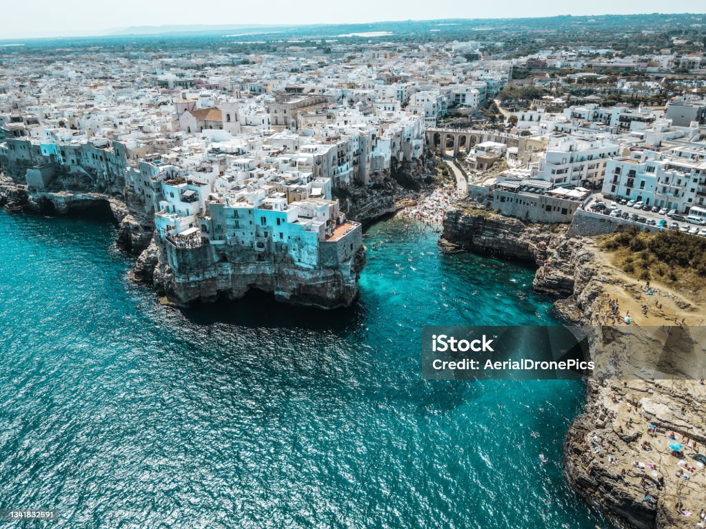 Aerial view Polignano a Mare, Puglia Aerial view of Polignano a Mare, in Puglia, south Italy. Drone view from above of this beautiful town on the cliffs in apulia. Puglia Stock Photo