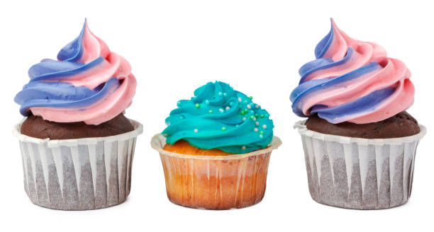 istock Three yummy cupcakes with icing isolated on white background 1341832803