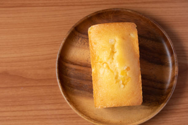 istock Orange cake with fresh milk on wooden floor 1341835289