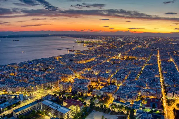 Aerial view of the city of Thessaloniki at sunset. Thessaloniki is the second largest city in Greece and the capital of Greek Macedonia. Image taken with action drone camera