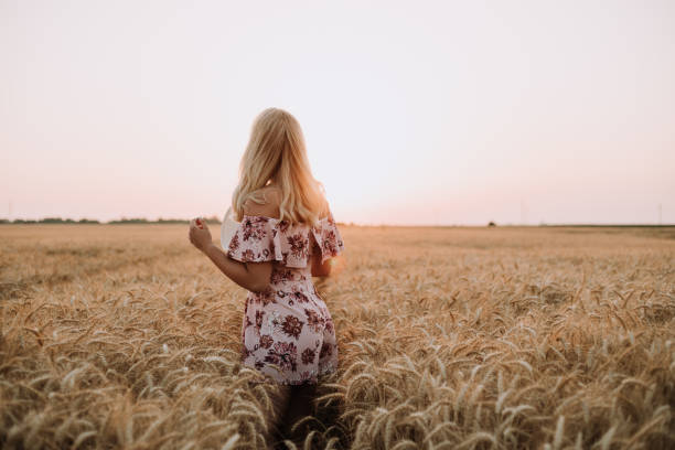 istock young woman in wheat field 1341838911