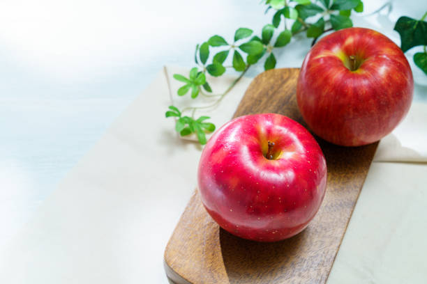Fresh apple on wooden table