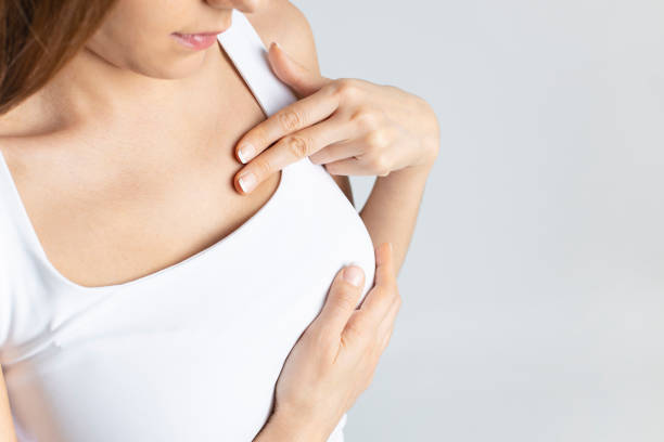 Woman do breast self exam stock photo