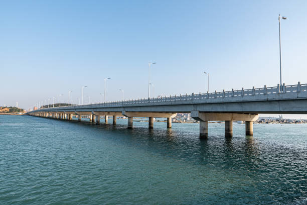 istock Long seaside bridges span the sea 1341841647