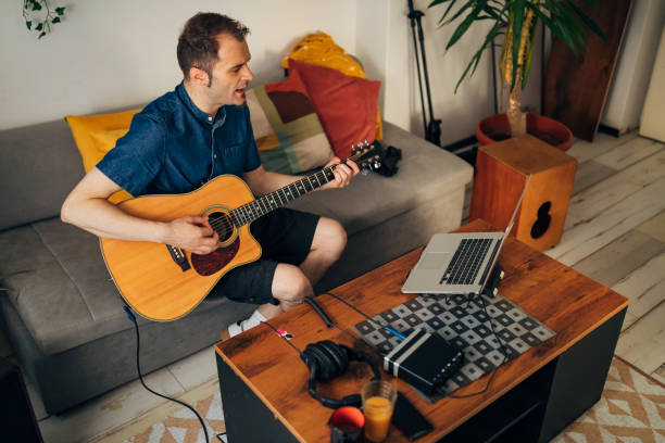 istock Constant practice is what makes this an amazing acoustic guitar player 1341844289