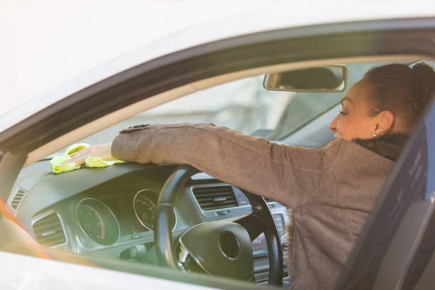 istock Cleaning her car after she finished driving it 1341846356