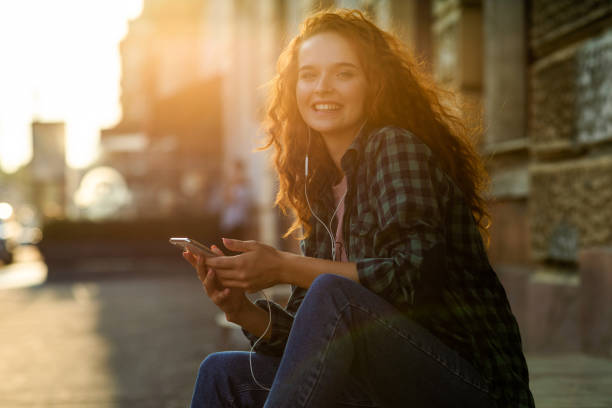 istock Young woman using phone 1341847483