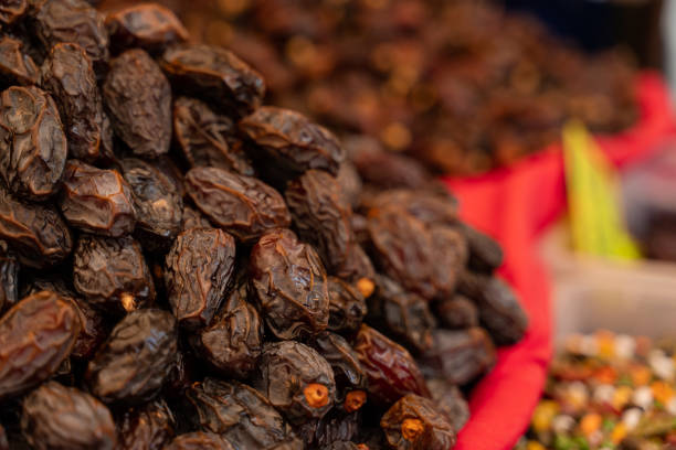 istock Dates on counter on Turkish market. Dried sweet dates. 1341848236