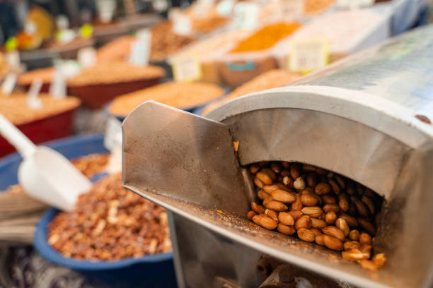 Roasting and blanching peanuts. Process of peeling peanuts in machine