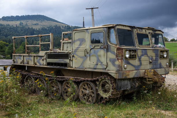 old rusty Soviet military tracked all-terrain vehicle.