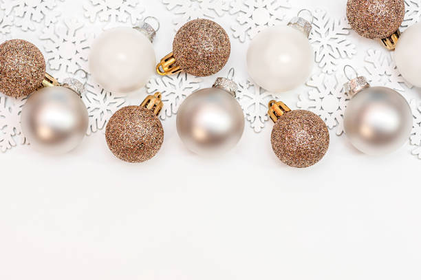 istock Christmas balls and white snowflakes on a white background. top view, copy space 1341849725