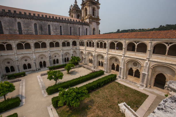 Alcobaca, portugal, june, 18, 2017 : exteriors of cloister and gardens of  Alcobaca monastery
