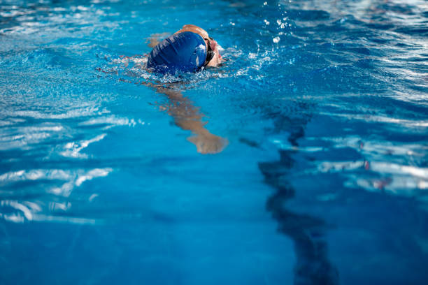 istock Swimmer breathing performing the crawl stroke 1341850034