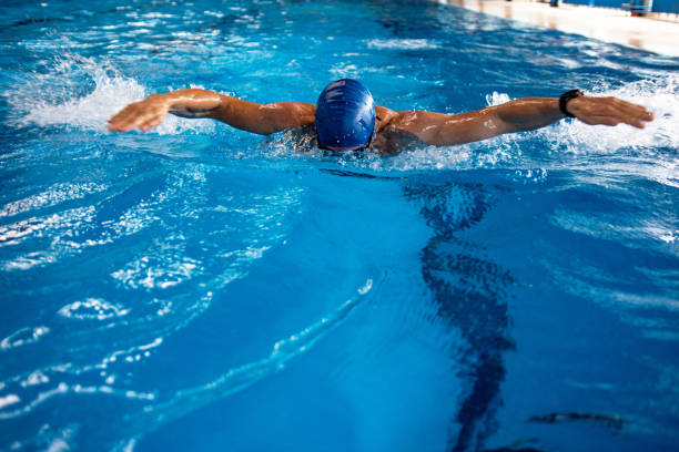 istock Man swimming butterfly stroke 1341850061