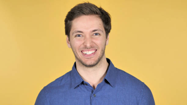 istock Happy Young Man Isolated on Yellow Background 1341850136