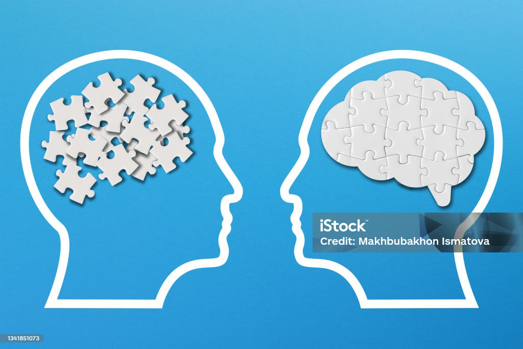 Different thinking, rational and irrational thinking concept. Mental health and problems with memory. Human brain shaped made of white jigsaw puzzles inside your head Contemplation Stock Photo