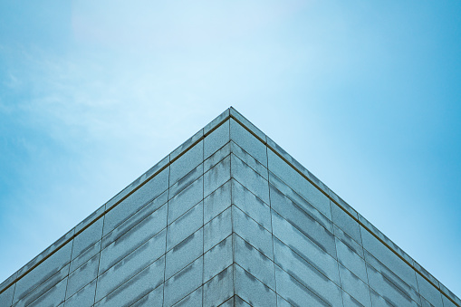 underside panoramic and perspective view to steel blue glass high rise building skyscrapers, business concept of successful industrial architecture