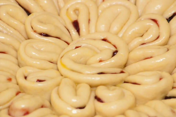 Close-up of a pie with fruit filling before baking in the oven. Homemade baking