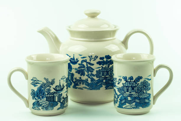 istock Three china-themed coffee cups and teapot. Porcelain or ceramic. 1341852574