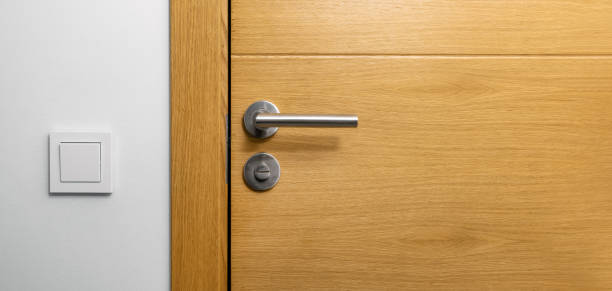 istock brown wooden door with metal handle. copy space 1341853096