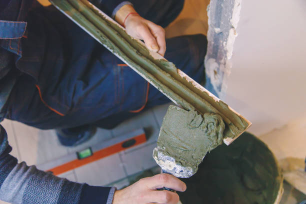 istock smear the tile repair in the house with a solution. Selective focus. 1341854018