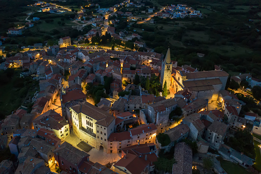 An aerial view of Bale - Valle at dusk, castle Soardo - Bembo and church of Visitation Blessed Virgin Mary to St. Elizabeth, Istria, Croatia
