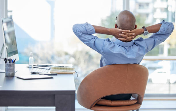 istock Shot of a businessman looking relaxed while sitting in his office 1341854833