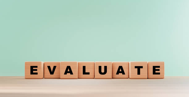 istock Evaluation wording print screen on wooden cube block on table for client or customer will evaluate score after use product and service by 3d rendering. 1341855815