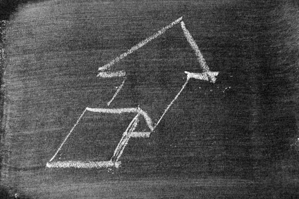 istock White chalk draw as upward arrow graph on blackboard or chalkboard background (Concept for sale, profit, cost of company in uptrend) 1341855910