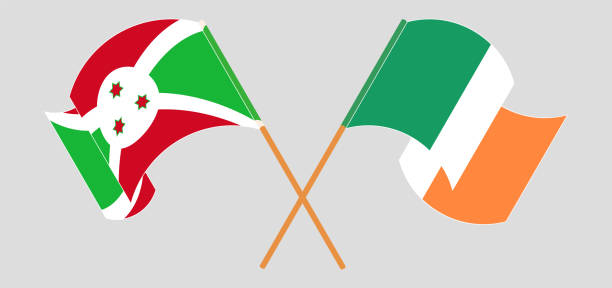 gekreuzte und wehende flaggen von burundi und irland - irish culture republic of ireland irish flag sport stock-grafiken, -clipart, -cartoons und -symbole