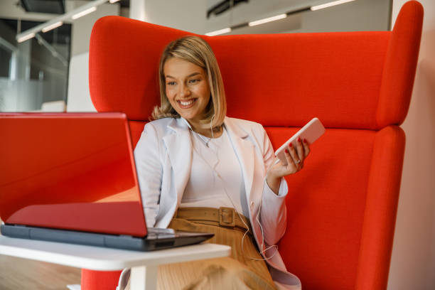 istock Young freelancer using laptop in coworking office 1341858866
