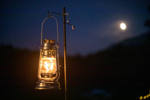 old lantern, camping scene - kerosene imagens e fotografias de stock