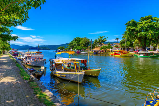 Embankment of historical center with boats in Paraty, Rio de Janeiro, Brazil Embankment of historical center with boats in Paraty, Rio de Janeiro, Brazil. Paraty is a preserved Portuguese colonial and Brazilian Imperial municipality paraty brazil stock pictures, royalty-free photos & images