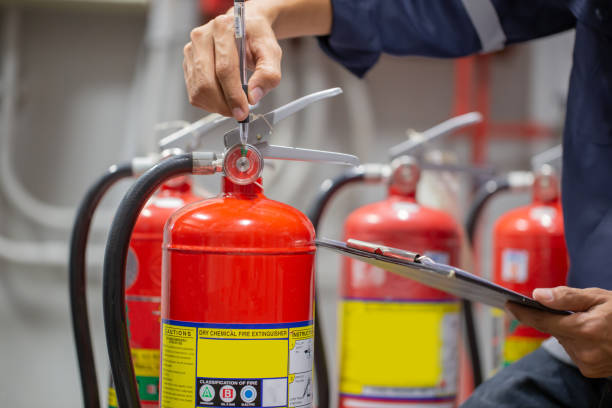 istock Engineer are checking and inspection a fire extinguishers tank in the fire control room for safety training and fire prevention. 1341861211