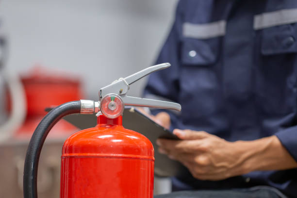 istock Engineer are checking and inspection a fire extinguishers tank in the fire control room for safety training and fire prevention. 1341861219