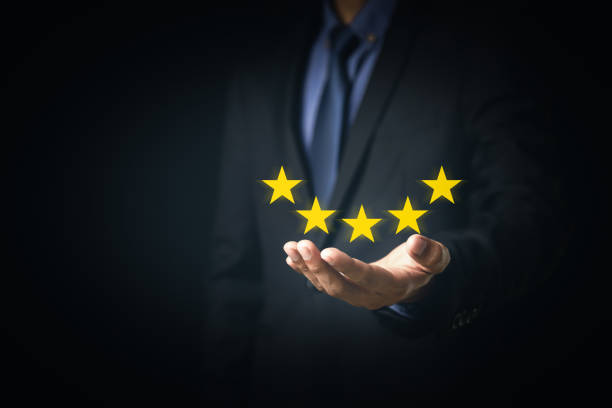 istock Customer Service and Satisfaction Concept Businessmen touch the virtual screen on happy smiley icons to achieve service satisfaction and feedback with excellent rated reviews. 1341862427