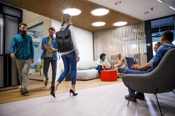 istock Business people working and passing through the office lobby 1341862670
