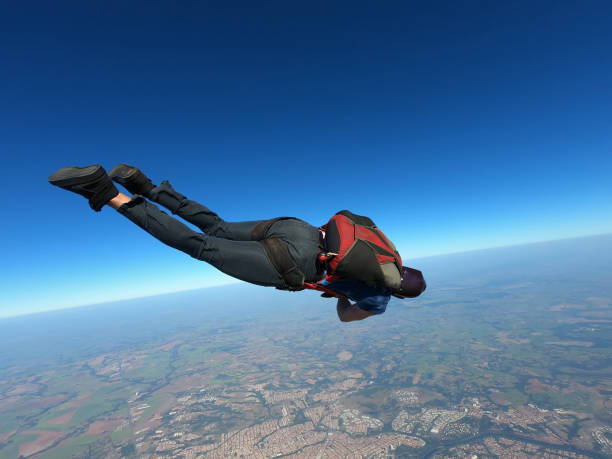 istock Parachutist performing a maneuver in a stretched body in free fall. 1341864142