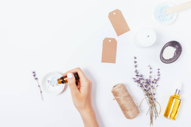 istock Homemade natural cosmetics, female hands adding essential oil 1341864638