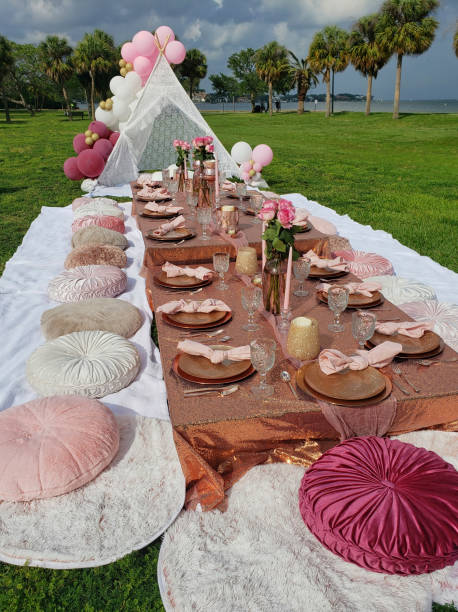 Fancy Picnic at Park An elaborate table setting for an outdoor party at a park. beautiful table setting stock pictures, royalty-free photos & images