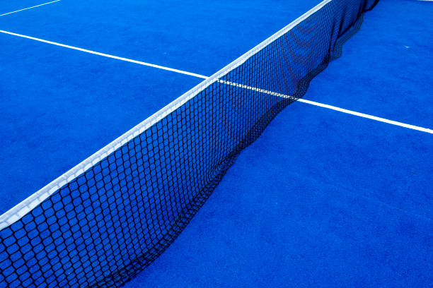 istock Net an lines on a blue paddle tennis court 1341868116
