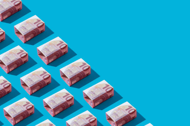 istock Euro Banknote Flat Lay on Blue Background 1341869102