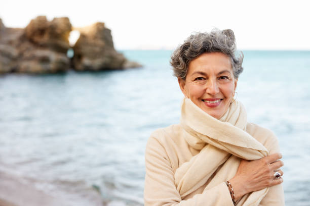 istock Beautiful middle aged woman enjoying nature. 1341870252