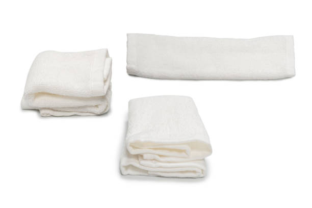 istock White fluffy cotton towel isolated on a white background. 1341871476
