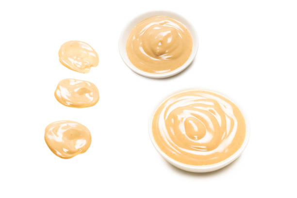 istock Mushroom sauce splashes isolated on white background. 1341871486