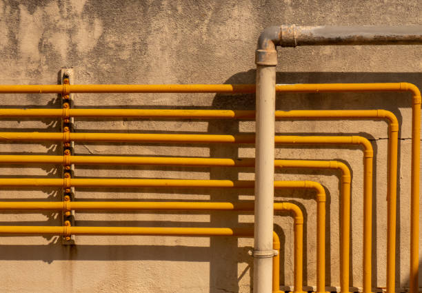 istock yellow pipes on the wall 1341872138