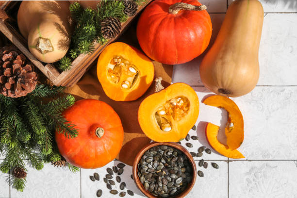 istock Autumn Pumpkin Variety with cut open Squash gourd and pumpkin seeds 1341873363