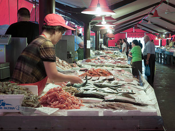 Chioggia (Venice), Italy - August 14, 2011: Fish market stall full of Adriatic sea fishes at Chioggia fresh fish market. Chioggia fish market, located along Canal Vena in old Town, is the real heart of this picturesque town located 15 miles south of Venice, on Venetian Lagoon, and famous all over Adriatic sea for its beautiful beaches and the huge fishing fleet.