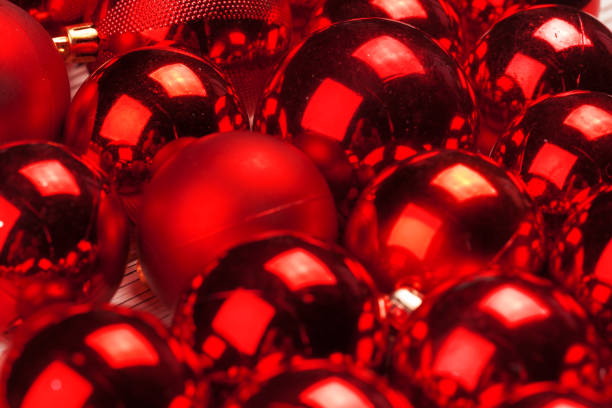 istock Beautiful Christmas background with red shiny baubles, copy space 1341878278